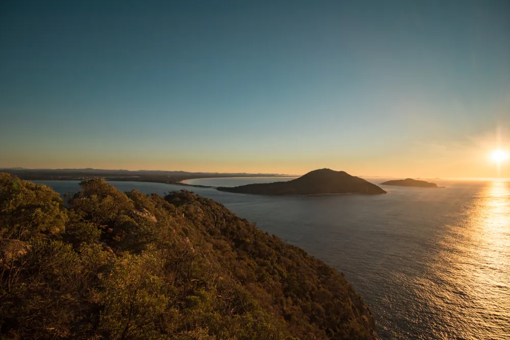 Sunset view over Port Stephens headlands and ocean from an elevated coastal lookout